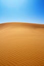 Sand dunes and cloudless sky Royalty Free Stock Photo