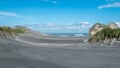 Sand dunes covered by green grass and ocean, Nelson Area, New Zealand Royalty Free Stock Photo