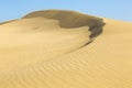 Sand dunes in the desert with blue sky Royalty Free Stock Photo