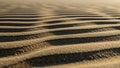 Sand dunes form a repetitive pattern with alternating light and Royalty Free Stock Photo
