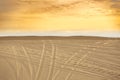 Sand Dunes full off vehicle tracks leaving three distinct paths forward. Mui Ne, Vietnam Royalty Free Stock Photo