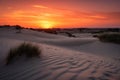 sand dunes glowing orange and red in magical sunset Royalty Free Stock Photo