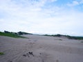 Sand Dunes hill white beach Green grass, and bright blue sky Royalty Free Stock Photo