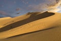 Singing Dunes at the sunset in Kazakhstan Royalty Free Stock Photo