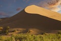 Singing Dunes at the sunset in Kazakhstan Royalty Free Stock Photo