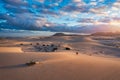 Sand dunes in Las Dunas de Corralejo, Corralejo Natural Park, dramatic cloud formation, Fuerteventura, Canary Islands, Spain. Sand Royalty Free Stock Photo