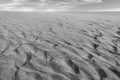 Black and white photo of the sand in the Dunes of Maspalomas, a small desert on Gran Canaria, Spain. Sand and sky. Royalty Free Stock Photo