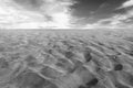 Black and white photo of the sand in the Dunes of Maspalomas, a small desert on Gran Canaria, Spain. Sand and sky. Royalty Free Stock Photo