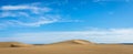 Sand in the Dunes of Maspalomas, a small desert on Gran Canaria, Spain. Sand and sky. Panorama image Royalty Free Stock Photo