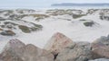 Sand dunes of misty Coronado beach, ocean waves in fog, California coast, USA. Royalty Free Stock Photo