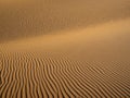 Sand dunes in Morocco, desert landscape, sand texture, tourist camp for night stay, panorama view of sunset over Sahara Royalty Free Stock Photo