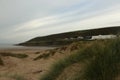 Sand dunes opening out onto Saunton Sands beach in Devon, South West, UK Royalty Free Stock Photo