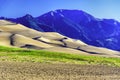 Sand dunes with Sangre de Cristo mountains Royalty Free Stock Photo