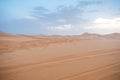 Sand dunes during sunset in Erg Chebbi desert, near Merzouga, Sahara Desert, in Morocco. Royalty Free Stock Photo