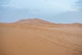 Sand dunes during sunset in Erg Chebbi desert, near Merzouga, Sahara Desert, in Morocco. Royalty Free Stock Photo