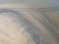 Sand view from a beach. pattern on beach side by sea waves.