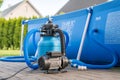 Sand filter system next to a pool in your own garden