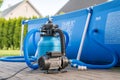 Sand filter system next to a pool in your own garden Royalty Free Stock Photo