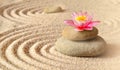 Sand, flower lily and spa stones in zen garden Royalty Free Stock Photo