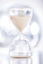 Sand flowing through an hourglass Royalty Free Stock Photo