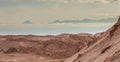 Sand formations, mountains, rocks at Valle de la Luna Moon Valley, San Pedro de Atacama Chile. Wide view of stunning sun rise on Royalty Free Stock Photo