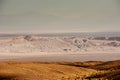 Sand formations, mountains, rocks at Valle de la Luna Moon Valley, San Pedro de Atacama Chile. Wide view of stunning sun rise on Royalty Free Stock Photo