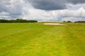 Sand golf bunker on a empty golf course before rain Royalty Free Stock Photo