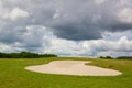 Sand golf bunker on a empty golf course before rain Royalty Free Stock Photo