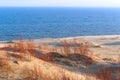 Sand dune, the sand and the grass on the hilly shore of the sea Royalty Free Stock Photo