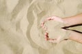 Sand in hands of girl. Hand strew sand Royalty Free Stock Photo