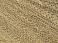 Sand That Has Been Run Over By Motorbikes, Traces Of Motorcycle Tires On Brown Sand Royalty Free Stock Photo