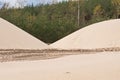 Sand heaps. Construction industry. Sand quarry. Horizontal photo.