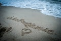 Sand lettering on the beach