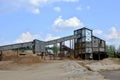 Sand making plant in mining quarry. Crushing factory with production line for crushing, grinding stone, sorting sand and bulk Royalty Free Stock Photo