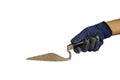 Sand for mixing cement on a plastering trowel, including the hands of a builder olated on white background.