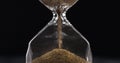 Measuring time with Hourglass and sand Royalty Free Stock Photo