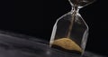 Measuring time with Hourglass and sand Royalty Free Stock Photo