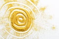 Sand painting. Golden glitter sun on white Royalty Free Stock Photo