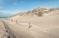 Sand path through the dunes to the Dutch North Sea beach Royalty Free Stock Photo