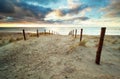 Sand path to North sea beach at sunset Royalty Free Stock Photo