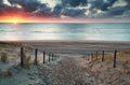 Sand path to North sea beach at sunset Royalty Free Stock Photo