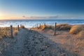 Sand path to North sea coast at sunset Royalty Free Stock Photo
