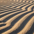 Sand patterns cast by light creating alternating light and shadow Royalty Free Stock Photo