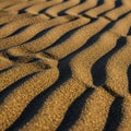 Sand patterns create a mesmerizing visual with alternating light Royalty Free Stock Photo