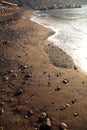 Sand. Perissa beach, Santorini, Greece