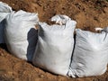 Sand pile and sandbags. A barricade wall made of sandbags