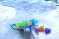 Sand playing toy ,shovel,dumpping wagon,water pot on beach front in summer vacation concept with copy space Royalty Free Stock Photo