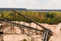 Sand quarry and conveyor belts. Construction industry. Horizontal photo Royalty Free Stock Photo