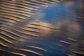 Sand ripple patterns at the beach during the sunrise Royalty Free Stock Photo