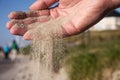 Sand running through hands